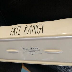 Egg tray. White w/black letters. No cracks or chips. I Used for display only.